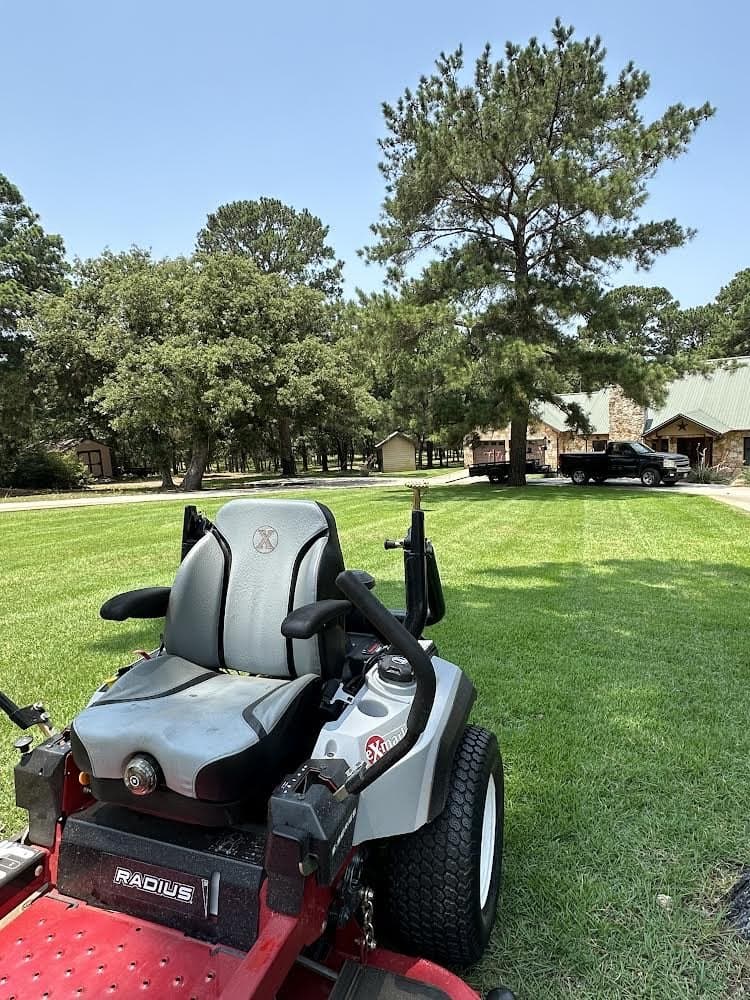 Zero-turn mower parked on a freshly cut lawn